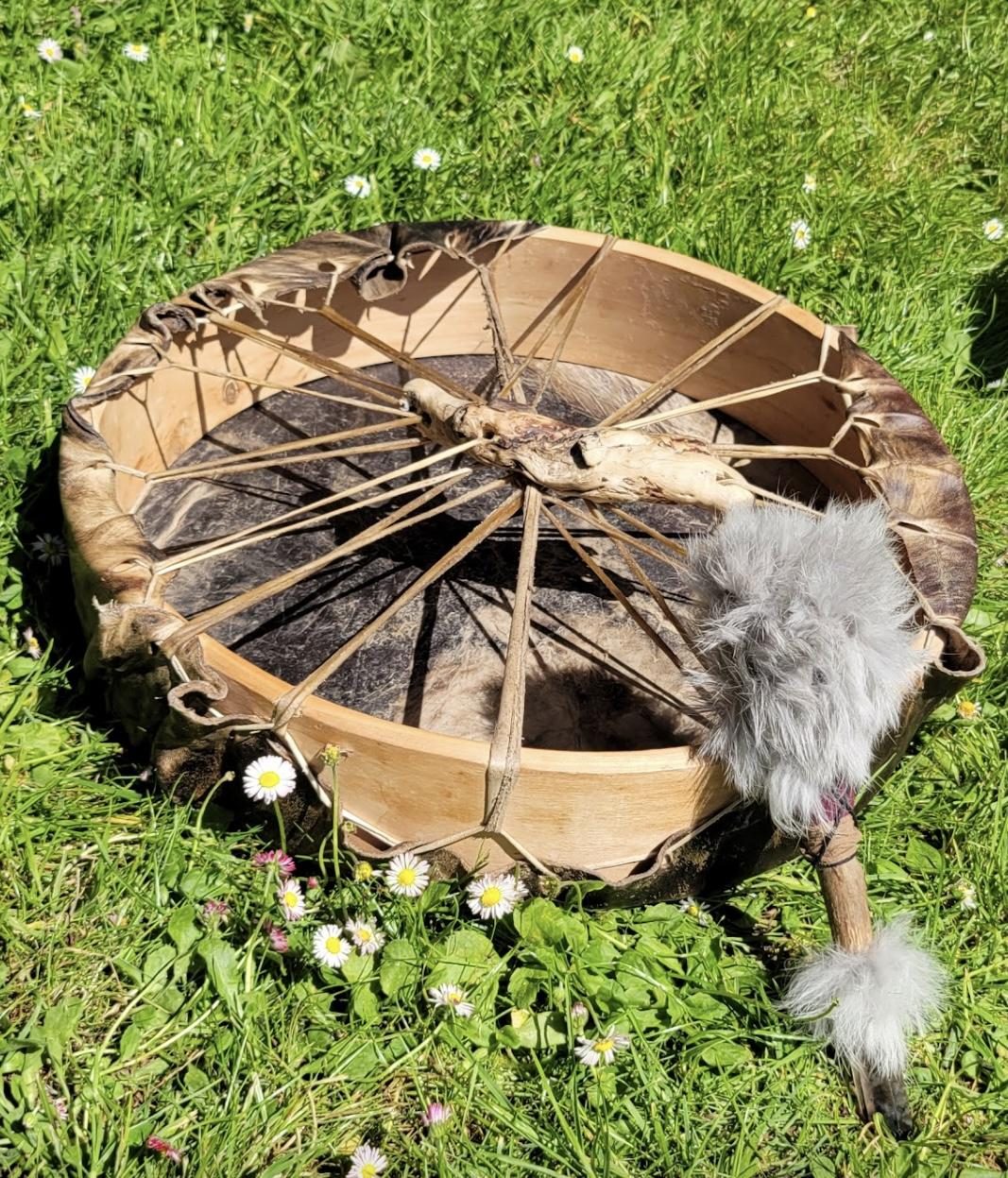 Handcrafted frame drum in the grass